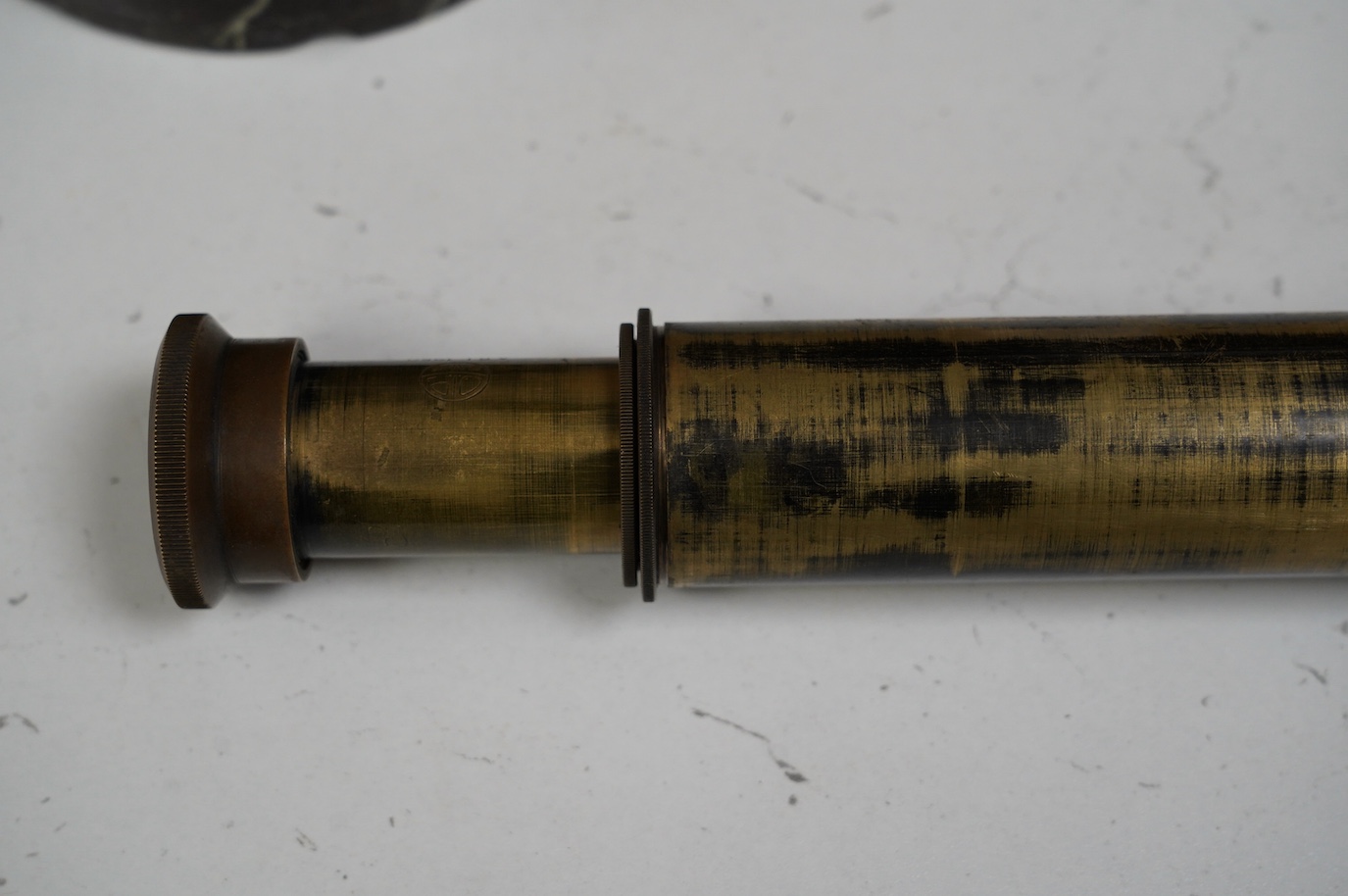 A brass three draw military telescope, marked “ABL 1950 Tel. Sgn. Mk VI. V6-OS 717 GA No 049”. Condition - fair to good, a little worn, good optics